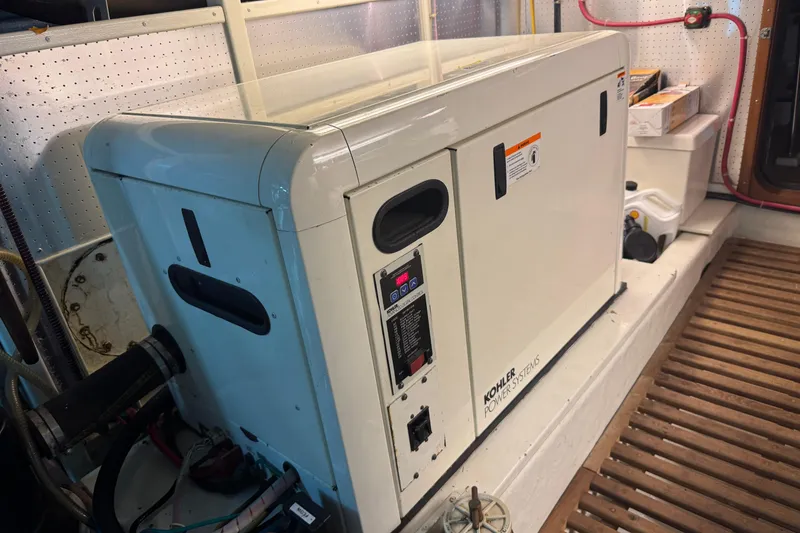 Slide: The Image of Kohler power system in 2006 DeFever 52 Euro yacht engine room. - 54