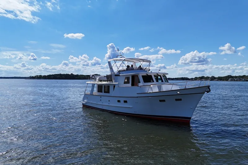 Slide: The Image of 2006 DeFever 52 Euro yacht cruising on a sunny day with blue skies. - 57