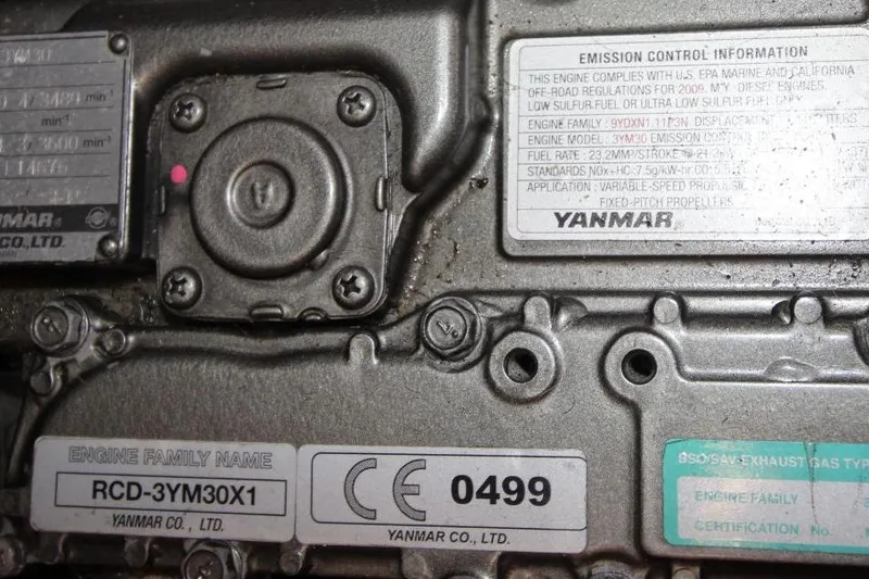 Slide: The Image of Close-up of a Yanmar engine label on a 1987 Catalina 34 sailboat. - 24