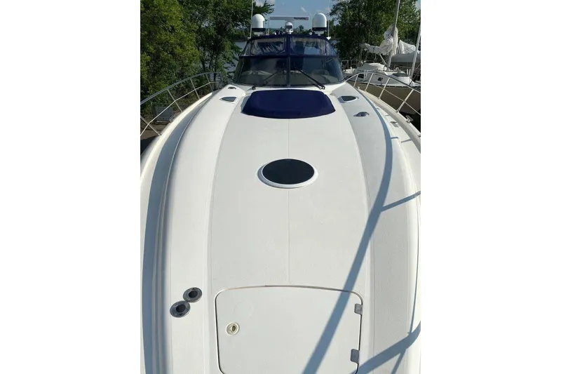 Slide: The Image of 1998 Sunseeker Predator 58 yacht deck, sleek design, white finish, outdoor view. - 10