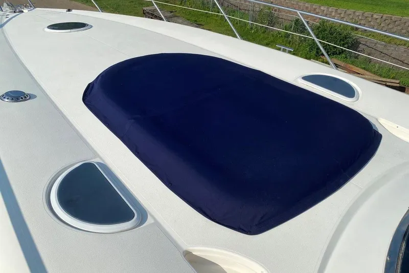 Slide: The Image of Sunseeker Predator 58 yacht deck with blue cover, 1998 model. - 12