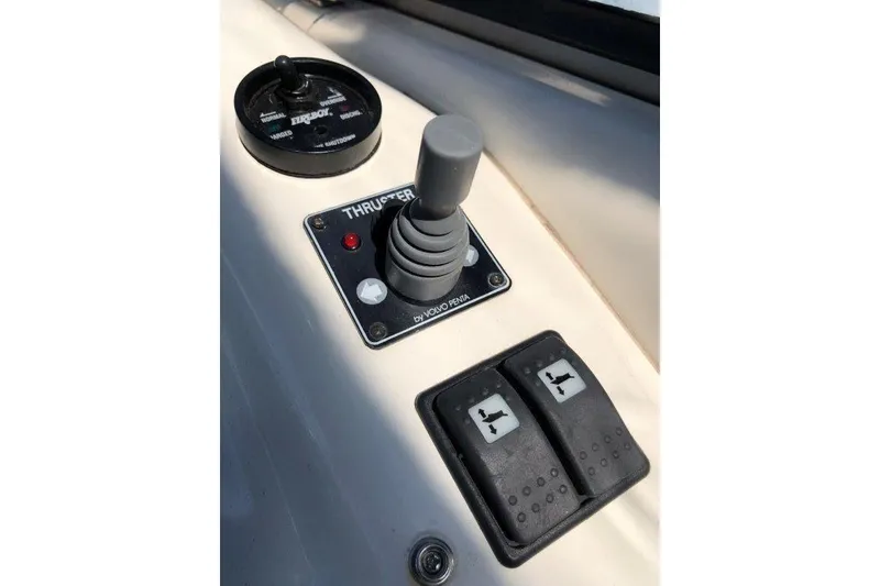 Slide: The Image of Control panel of a 1998 Sunseeker Predator 58 yacht, featuring thruster joystick and switches. - 17