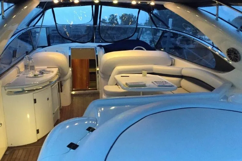 Slide: The Image of Luxurious interior of a 1998 Sunseeker Predator 58 yacht with elegant seating and table. - 18