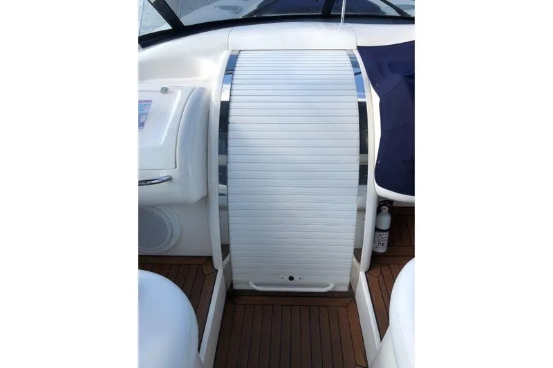 Slide: The Image of 1998 Sunseeker Predator 58 yacht interior with sleek white paneling and wood flooring. - 20