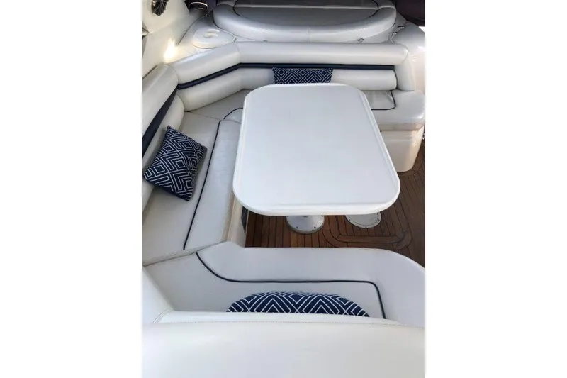 Slide: The Image of Luxurious seating area on 1998 Sunseeker Predator 58 yacht with white cushions and blue pillows. - 25