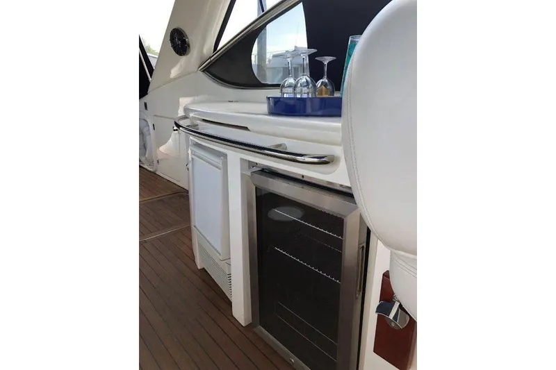 Slide: The Image of Interior of 1998 Sunseeker Predator 58 yacht with bar area and glassware. - 27