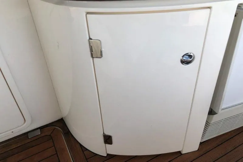 Slide: The Image of Cabinet door on 1998 Sunseeker Predator 58 yacht with wooden flooring. - 29