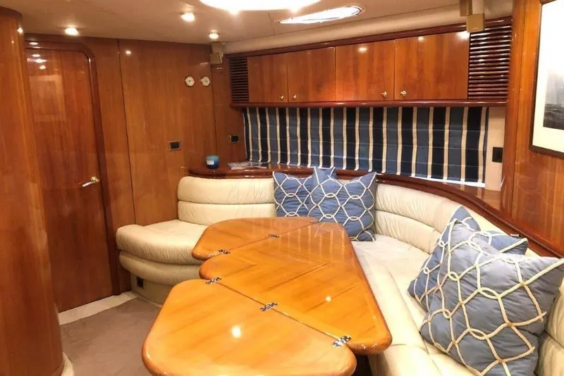 Slide: The Image of Luxurious interior of 1998 Sunseeker Predator 58 yacht with elegant wood finish and plush seating. - 33