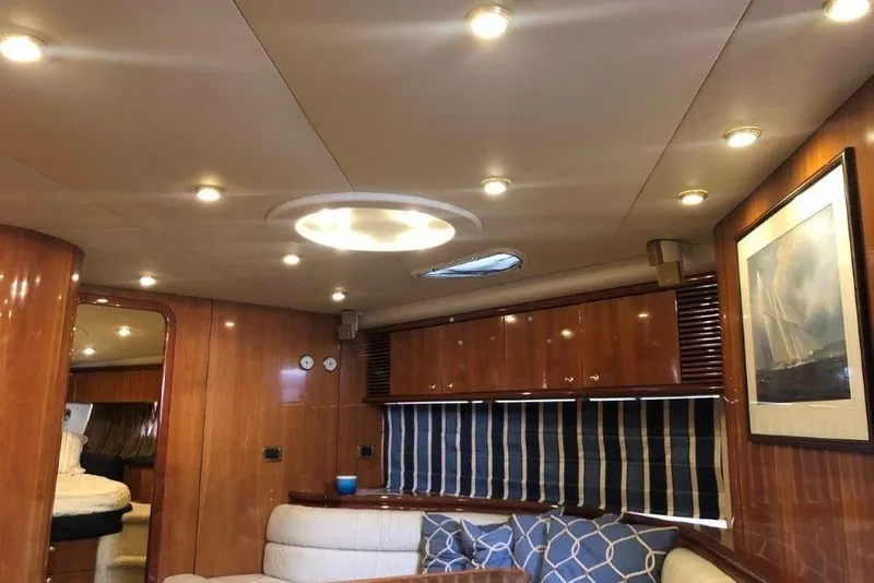 Slide: The Image of Luxurious interior of 1998 Sunseeker Predator 58 yacht with wood paneling and cozy seating. - 34