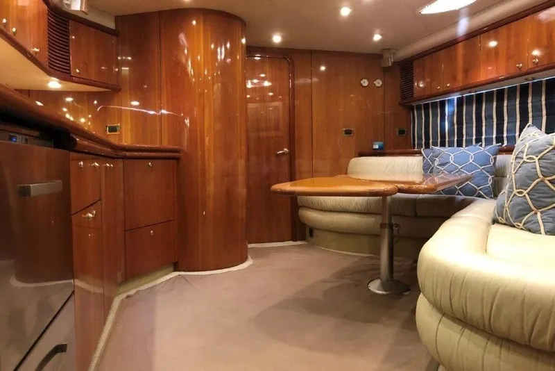 Slide: The Image of Luxurious interior of a 1998 Sunseeker Predator 58 yacht with elegant wood finishes. - 36