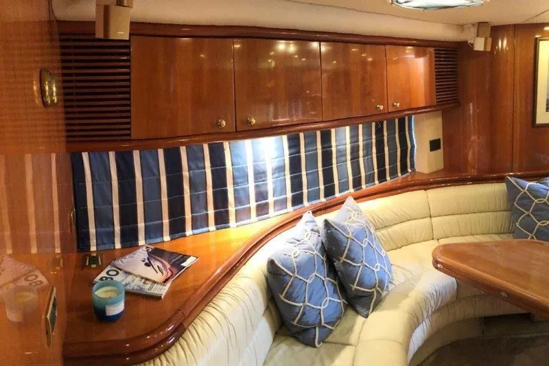 Slide: The Image of Interior of 1998 Sunseeker Predator 58 yacht with elegant wood finish and plush seating. - 47