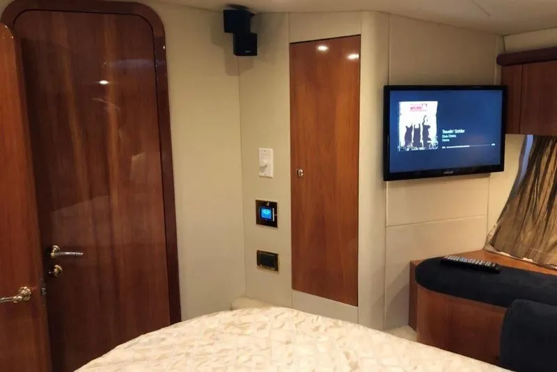 Slide: The Image of Luxurious cabin interior of 1998 Sunseeker Predator 58 yacht with TV and wood finishes. - 53
