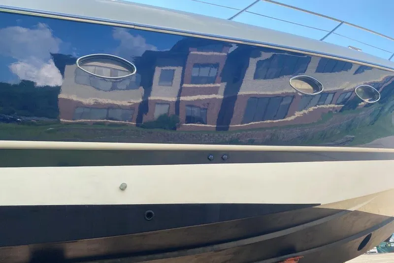 Slide: The Image of 1998 Sunseeker Predator 58 yacht hull with building reflection. - 7
