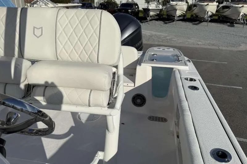 Slide: The Image of 2026 Sea Fox 248 Commander boat interior with white seating and steering wheel. - 12