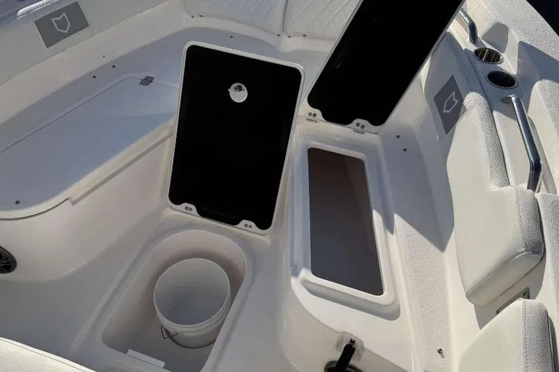 Slide: The Image of 2026 Sea Fox 248 Commander boat interior with open storage compartments and seating. - 18