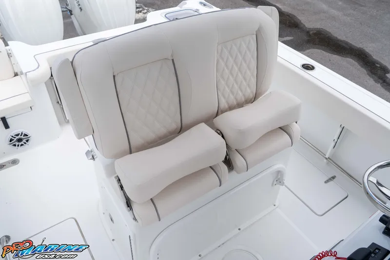 Slide: The Image of 2026 Sea Hunt Gamefish 25 boat with luxurious dual captain's seats and diamond stitching. - 15