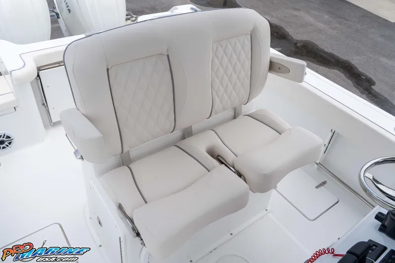 Slide: The Image of Luxurious seating on 2026 Sea Hunt Gamefish 25 boat, featuring plush, diamond-stitched upholstery. - 16