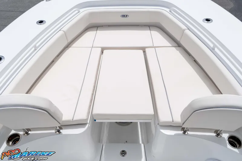 Slide: The Image of 2026 Sea Hunt Gamefish 25 boat with cushioned seating area. - 25