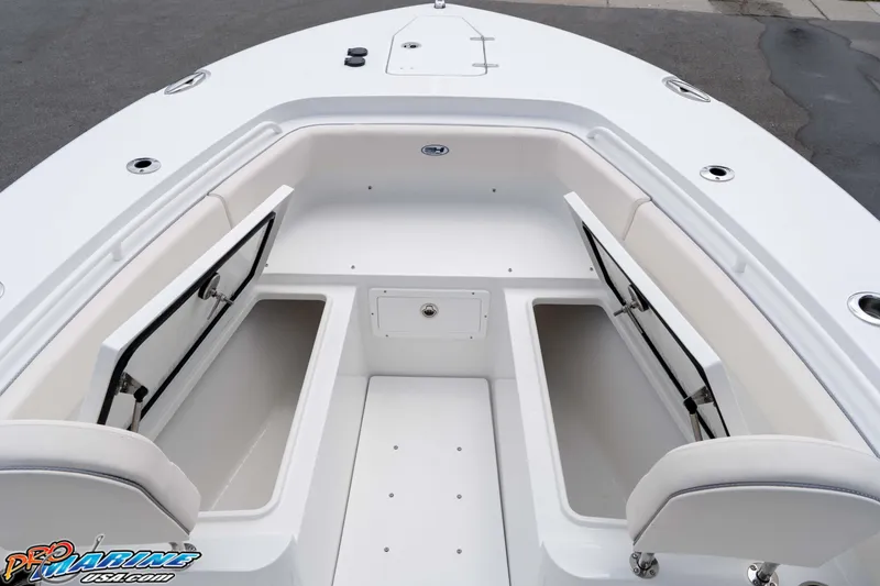 Slide: The Image of 2026 Sea Hunt Gamefish 25 boat interior with open storage compartments. - 27