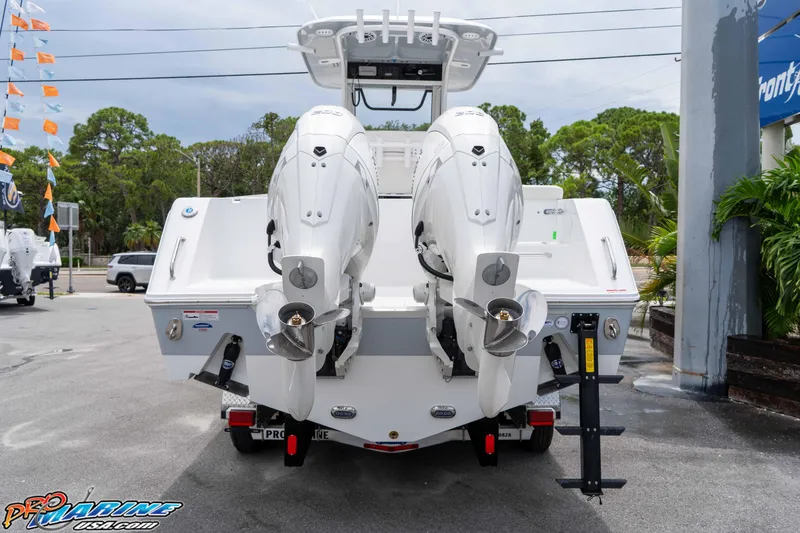 Slide: The Image of 2026 Sea Hunt Gamefish 25 with dual outboard motors, rear view. - 4