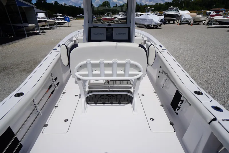Slide: The Image of 2025 Tidewater 272 LXF boat interior with seating and Garmin electronics. - 29