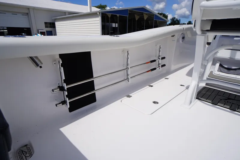 Slide: The Image of 2025 Tidewater 272 LXF boat interior with rod holders and seating area. - 31