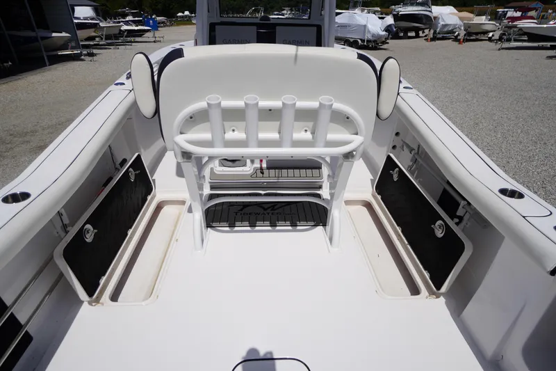 Slide: The Image of 2025 Tidewater 272 LXF boat interior with rod holders and storage compartments. - 34
