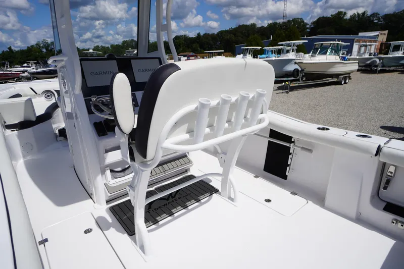 Slide: The Image of 2025 Tidewater 272 LXF boat interior with Garmin displays and rod holders. - 35