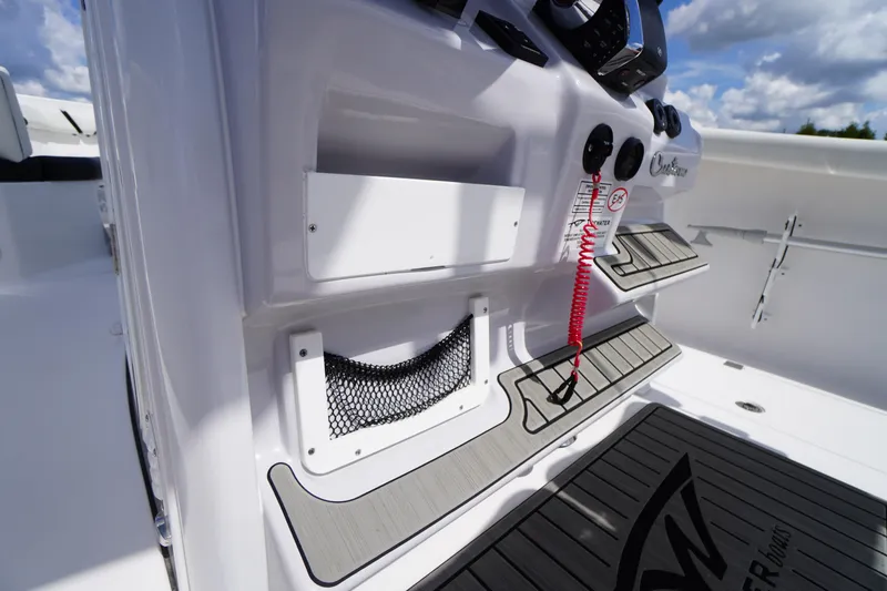 Slide: The Image of 2025 Tidewater 272 LXF boat interior with modern dashboard and safety features. - 43
