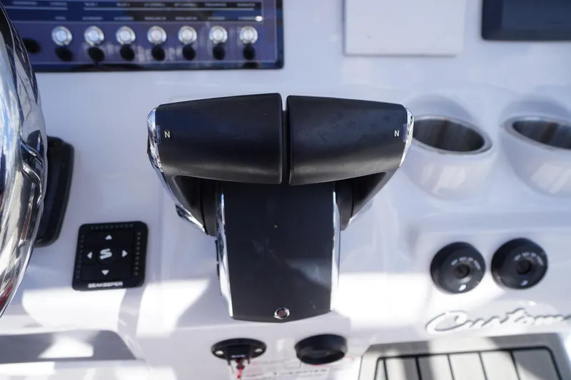 Slide: The Image of 2025 Tidewater 272 LXF boat controls and dashboard close-up. - 48