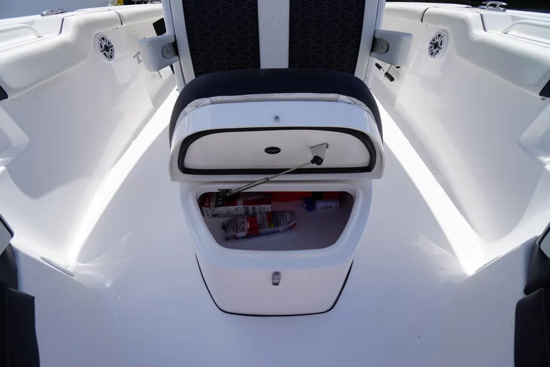 Slide: The Image of 2025 Tidewater 272 LXF boat interior with open storage compartment. - 65