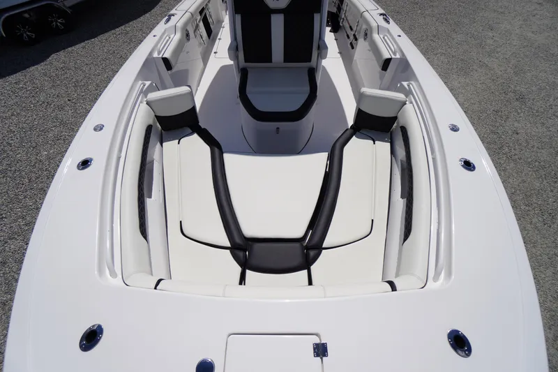 Slide: The Image of 2025 Tidewater 272 LXF boat interior with sleek white and black seating design. - 71
