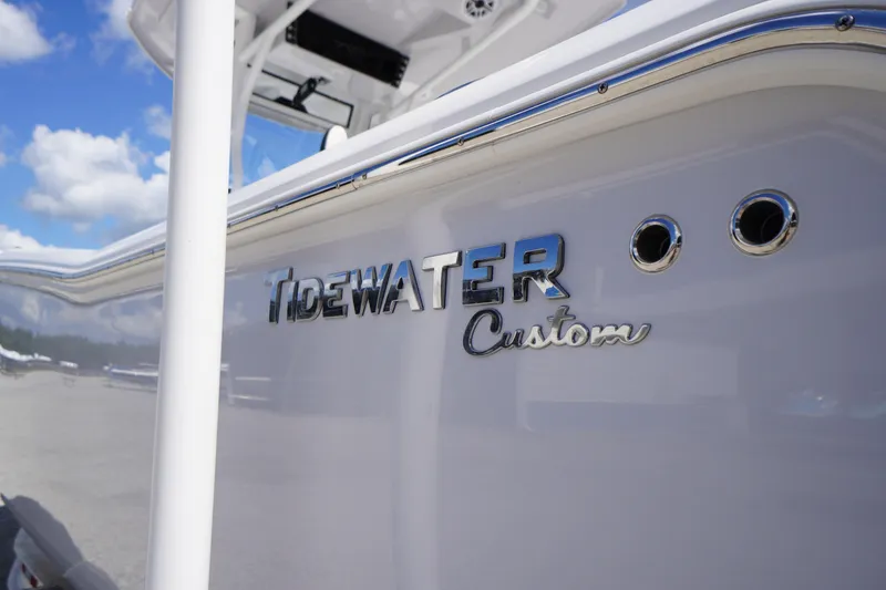 Slide: The Image of 2025 Tidewater 272 LXF boat with custom logo and sleek design. - 8