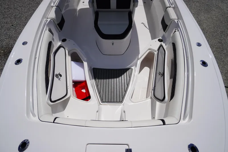 Slide: The Image of 2025 Tidewater 272 LXF boat interior with open storage compartments. - 80