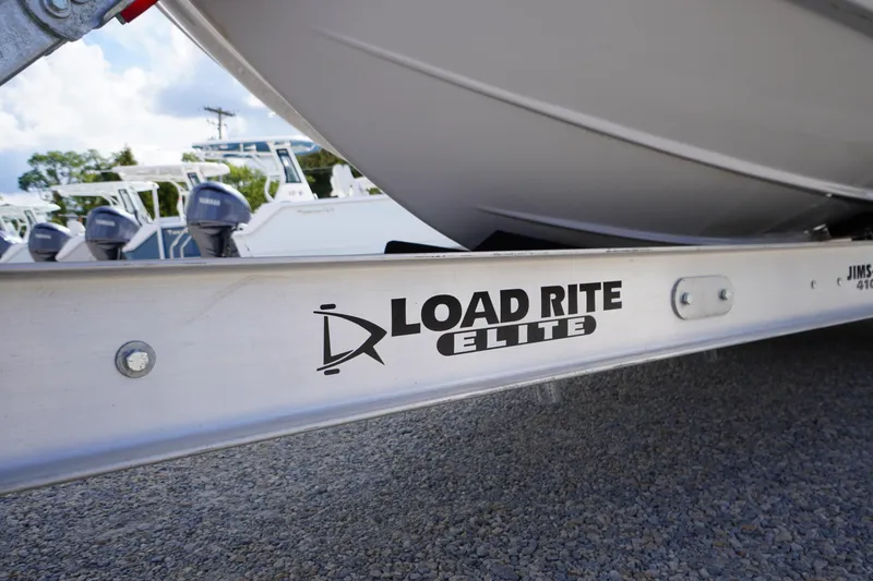 Slide: The Image of 2025 Tidewater 272 LXF on Load Rite Elite trailer, parked on gravel. - 88