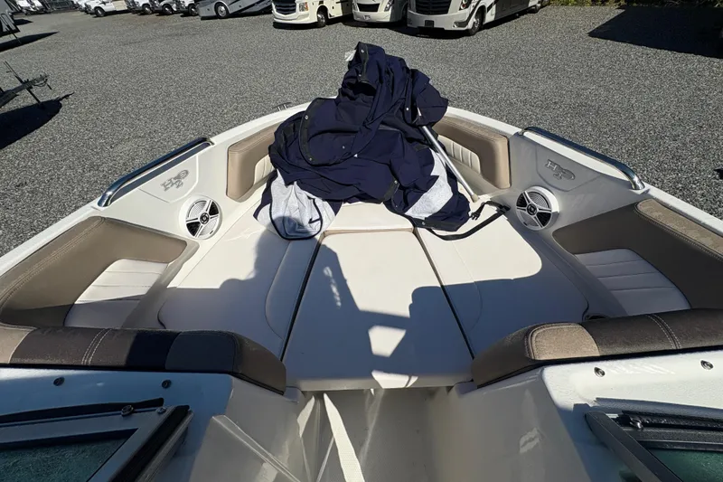 Slide: The Image of 2019 Chaparral 18 H2O Sport boat interior with seating and speakers. - 12