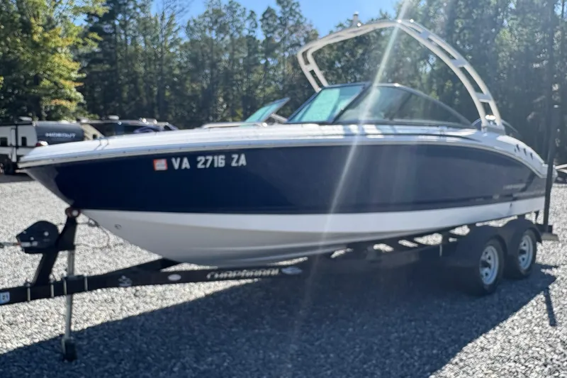 The Image of 2019 Chaparral 18 H2O Sport boat on trailer, parked outdoors. - 1