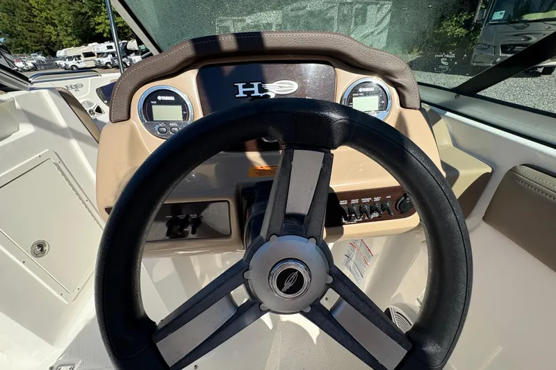 Slide: The Image of 2019 Chaparral 18 H2O Sport dashboard with steering wheel and instrument panel. - 9
