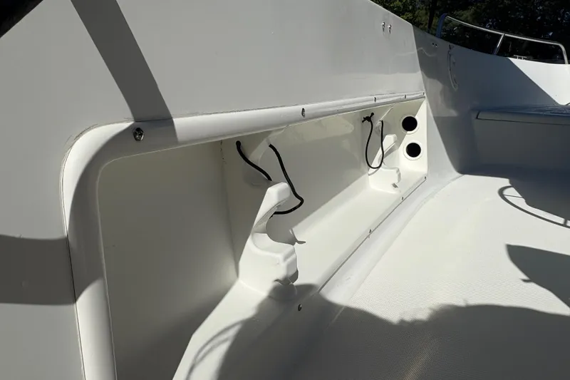 Slide: The Image of Interior view of 2000 Hydra-Sports 180 Seahorse CC boat, featuring storage compartment. - 11