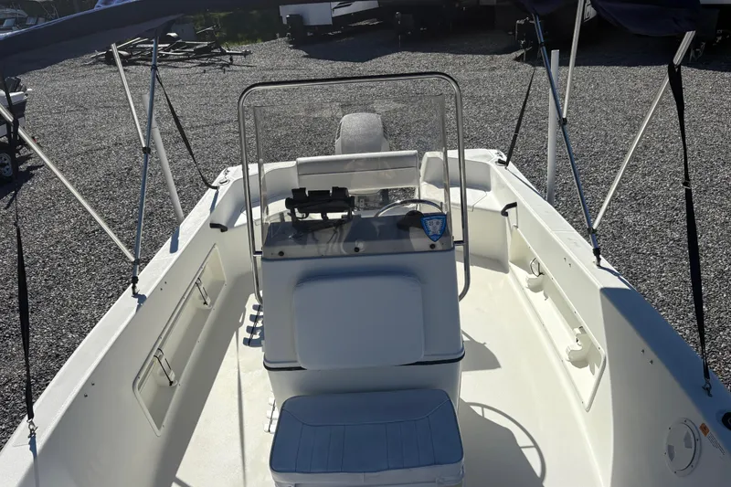 Slide: The Image of 2000 Hydra-Sports 180 Seahorse CC boat interior with seating and steering console. - 17