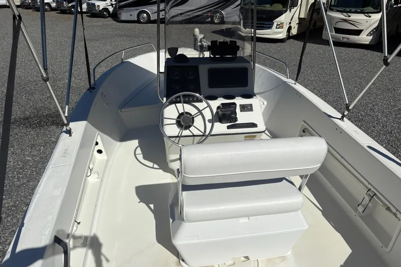 Slide: The Image of 2000 Hydra-Sports 180 Seahorse CC boat interior with steering wheel and controls. - 8
