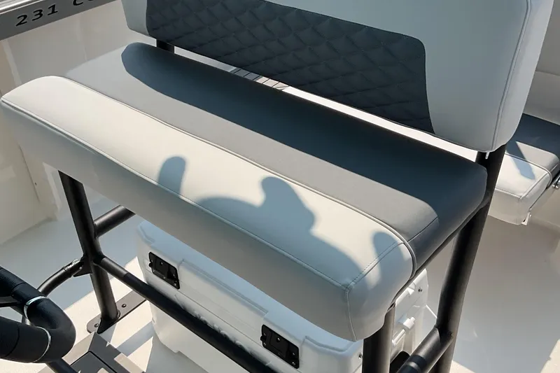 Slide: The Image of 2026 Starcraft SVX 231 OB CC boat seat with black frame and white cushion. - 10