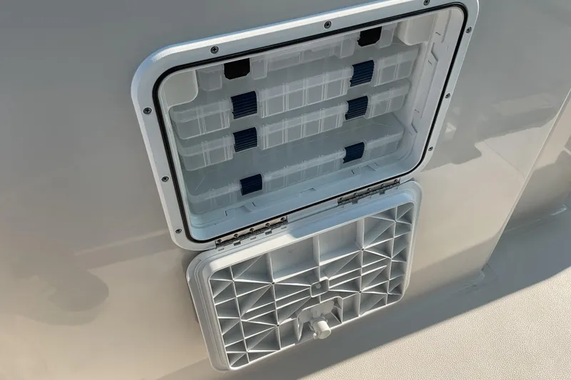 Slide: The Image of Open storage compartment on 2026 Starcraft SVX 231 OB CC boat. - 20