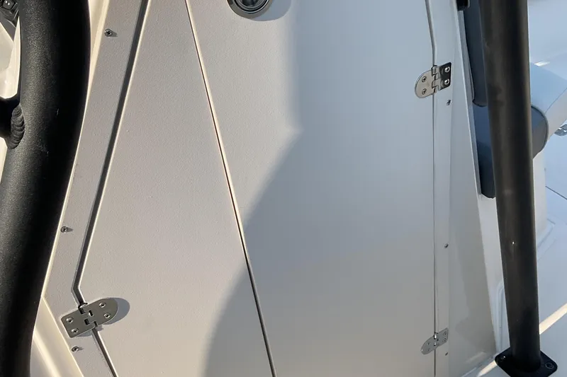 Slide: The Image of 2026 Starcraft SVX 231 OB CC boat interior detail with hinges and railing. - 21