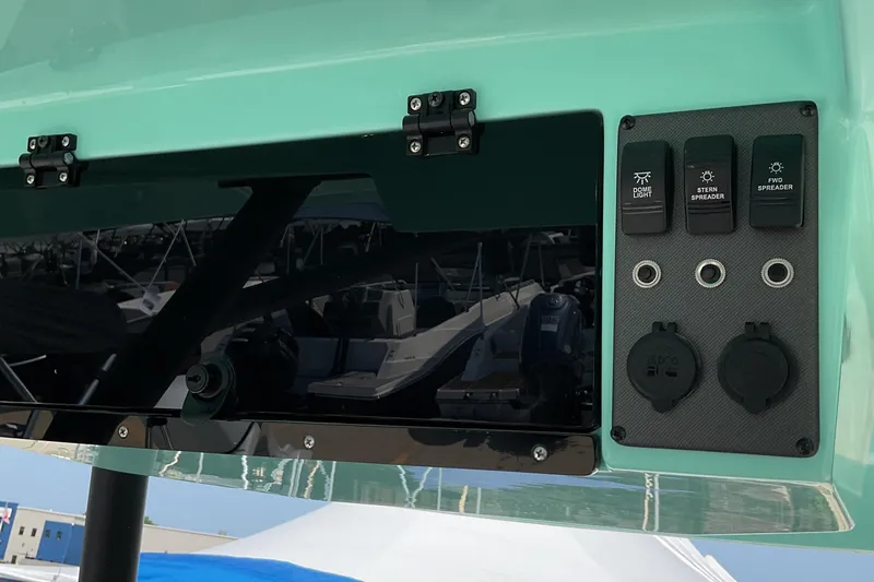 Slide: The Image of 2026 Starcraft SVX 231 OB CC boat control panel with switches and outlets. - 5