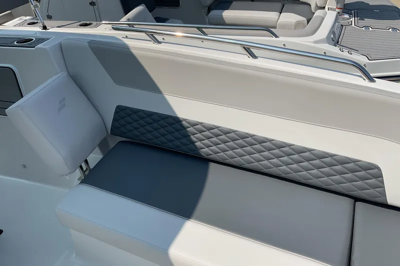 Slide: The Image of 2026 Starcraft SVX 231 OB CC boat interior with cushioned seating and sleek design. - 7