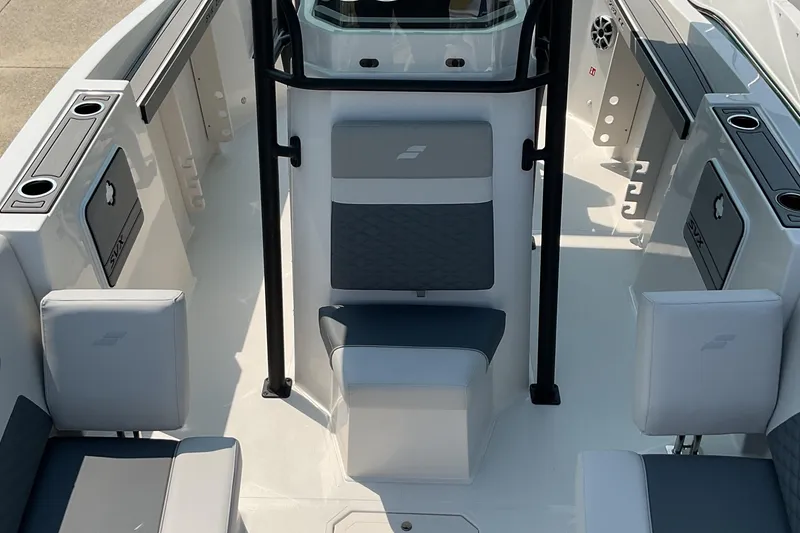 Slide: The Image of 2026 Starcraft SVX 231 OB CC boat interior with seating and storage compartments. - 9