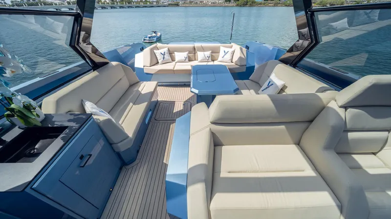 Slide: The Image of Luxurious 2024 Vanquish Yachts VQ58 interior with elegant seating and scenic water views. - 4