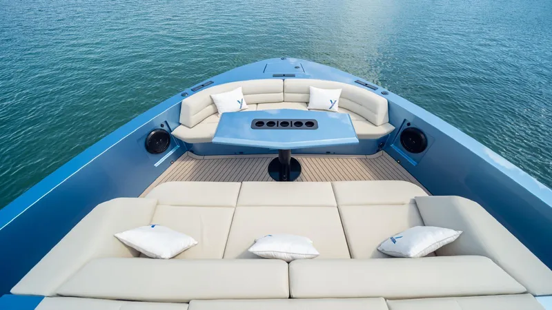 Slide: The Image of Luxurious 2024 Vanquish Yachts VQ58 with elegant seating and table on deck. - 5