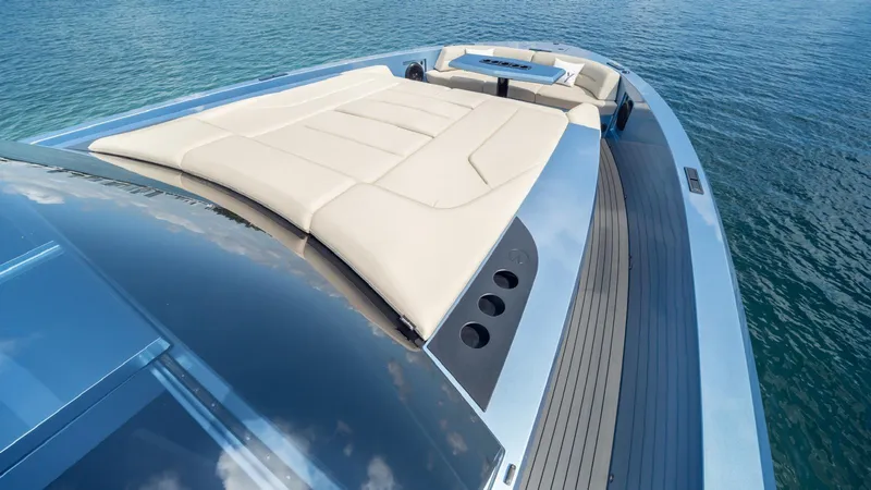 Slide: The Image of 2024 Vanquish Yachts VQ58 luxury yacht with sleek design and spacious deck. - 6